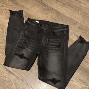 AE Next Level Stretch black distressed jeans